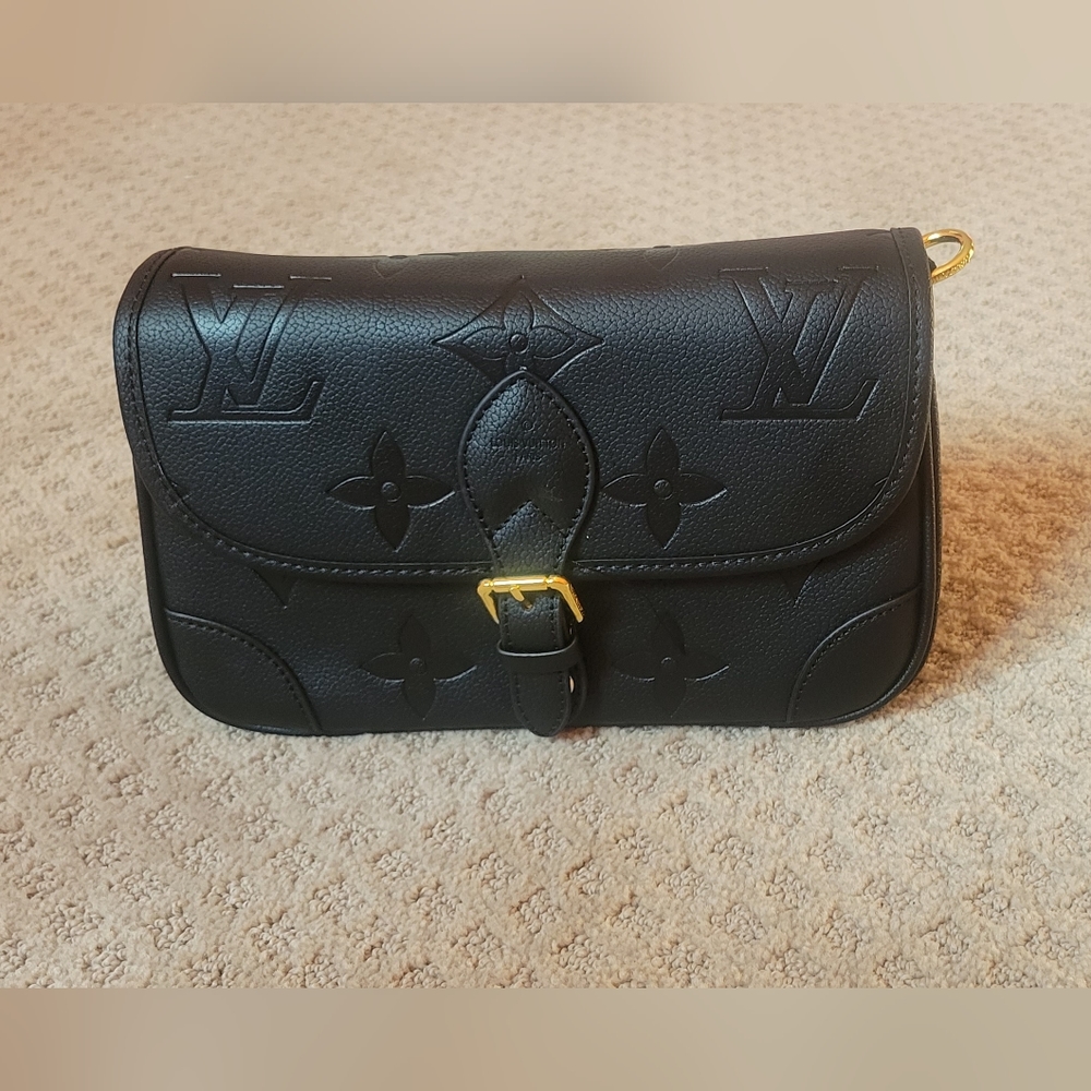 Black and gold LV purse